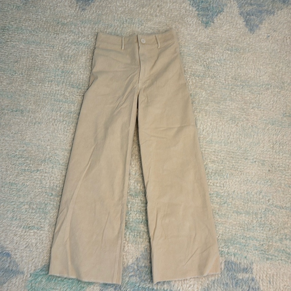 Off white fine cords. Big back pockets. High waste. Flair leg.